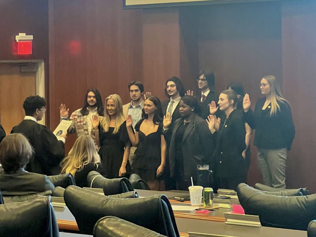 New senators are sworn in by Associate Justice Francis Felix Javier with Senate Pro-Tempore Amelia Dyal and Senate President Audrey McGrath alongside them.